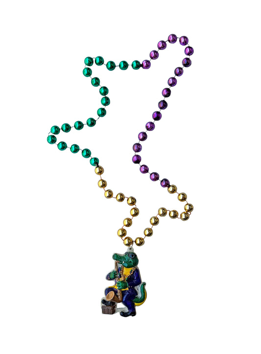 Médaillon Alligator jouant du saxophone sur un collier de perles fantaisie violet, vert et or