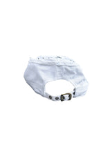 White Cap with a Sequined Hamsa Symbol
