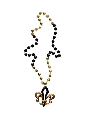 Medallón calado Fleur de Lis negro y dorado sobre cuenta especial negra y dorada