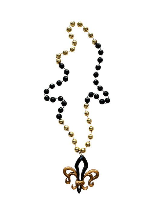 Médaillon ajouré fleur de lys noir et or sur perle fantaisie noire et or