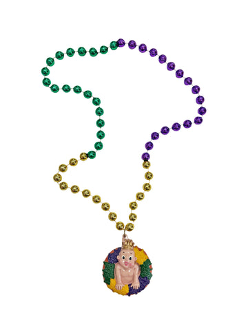 Rosca de Reyes de Mardi Gras y muñeco sobre un collar de cuentas de colores púrpura, verde y dorado