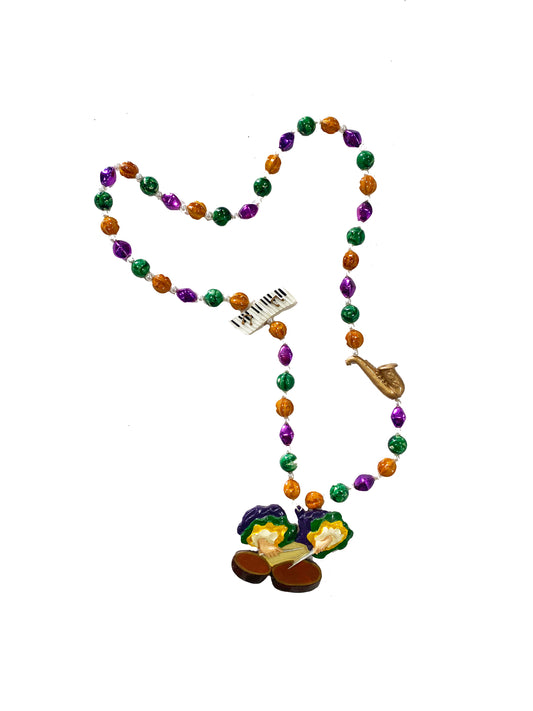 Trio d'instruments de percussion sur perles fantaisie or, vert et violet