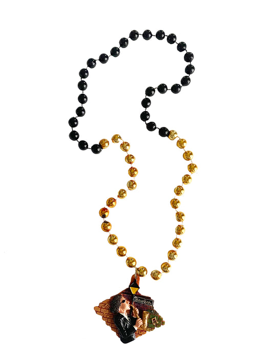Musicien de jazz de Bourbon Street sur un collier de perles fantaisie noir et or