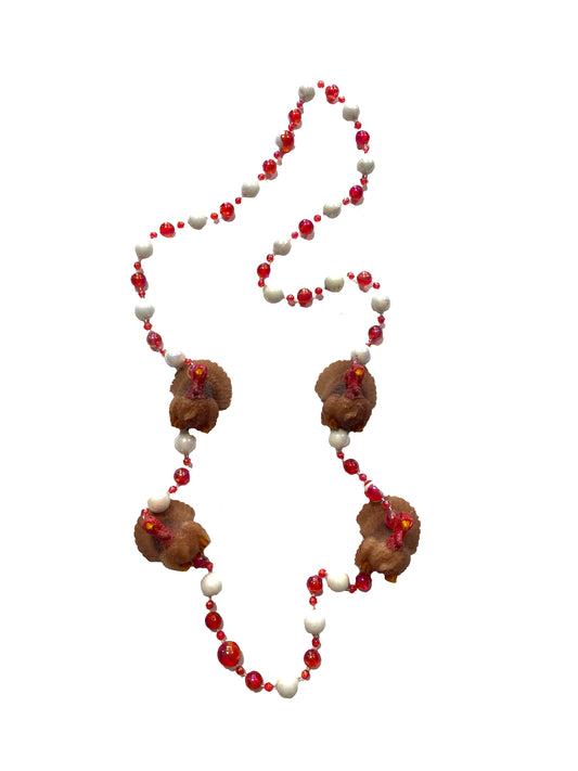 Médaillons de dinde sur brochettes de perles rouges et blanches