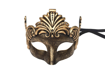 Máscara de bronce con forma de ojo de gato y espirales románicos