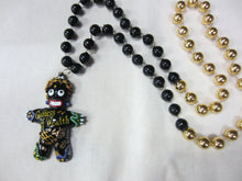 Goddess of Wealth Voodoo Medallion on a Black and Gold Specialty Bead