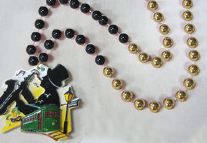 Street Musician (Saxophone Player), Streetcar and Street Lamp on a Black and Gold Specialty Beads